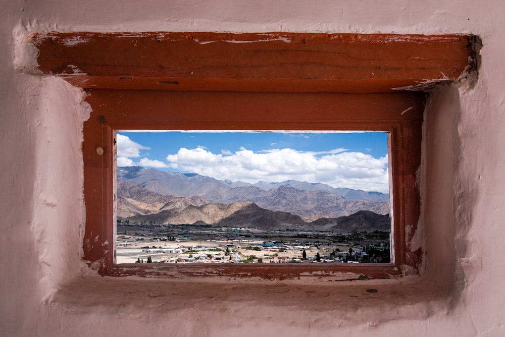 brown wooden framed glass window