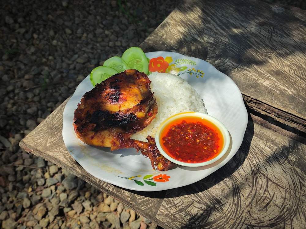 cooked meat with sauce on white ceramic plate