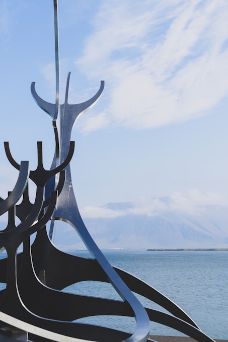 black metal frame near sea during daytime