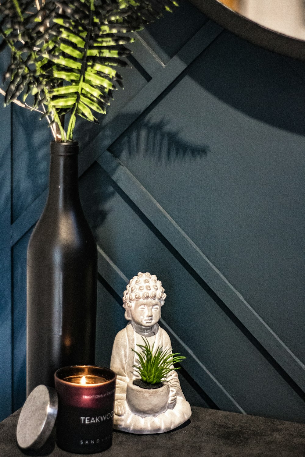 green plant on brown glass vase