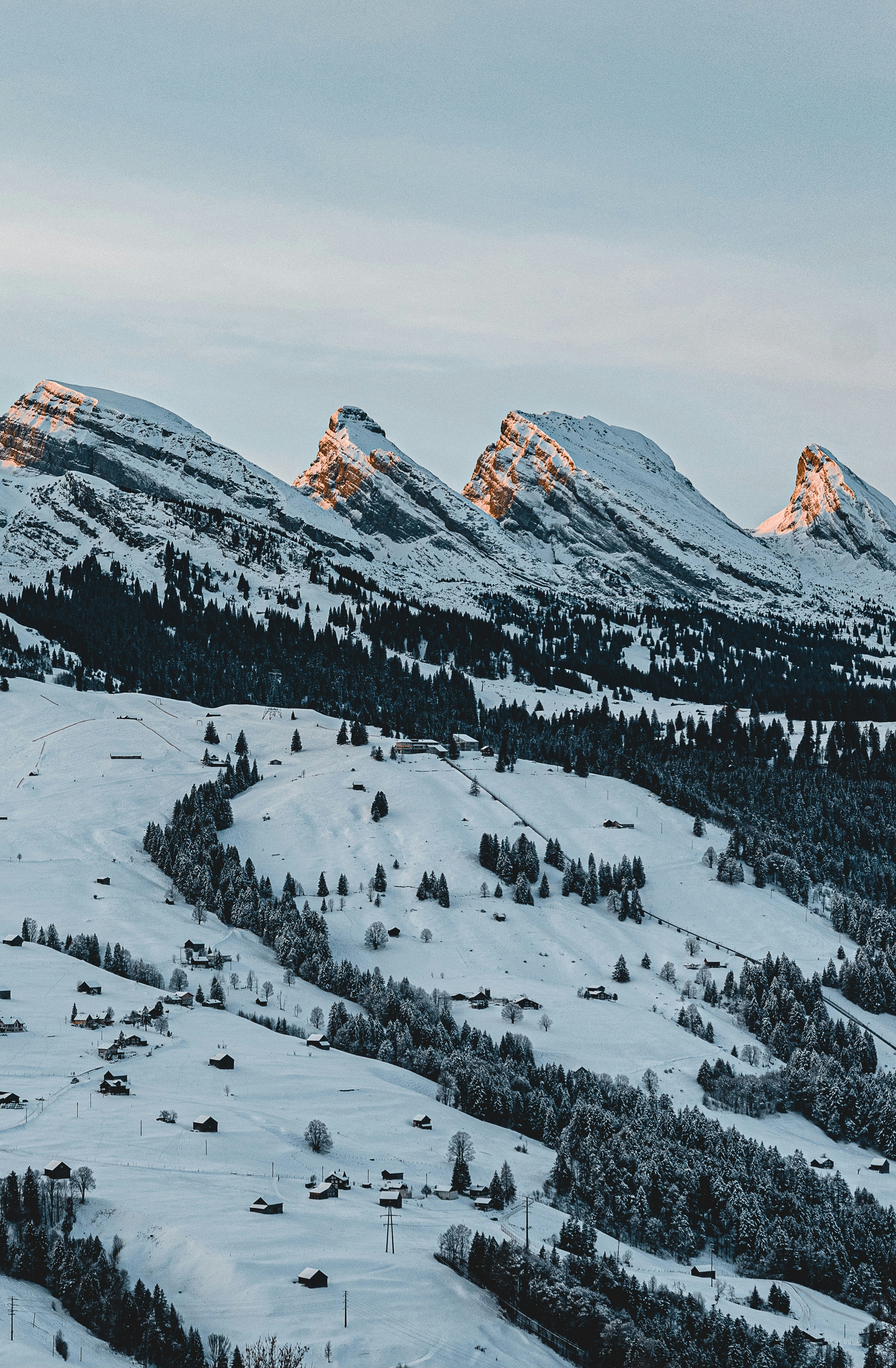 snow covered mountain during daytime