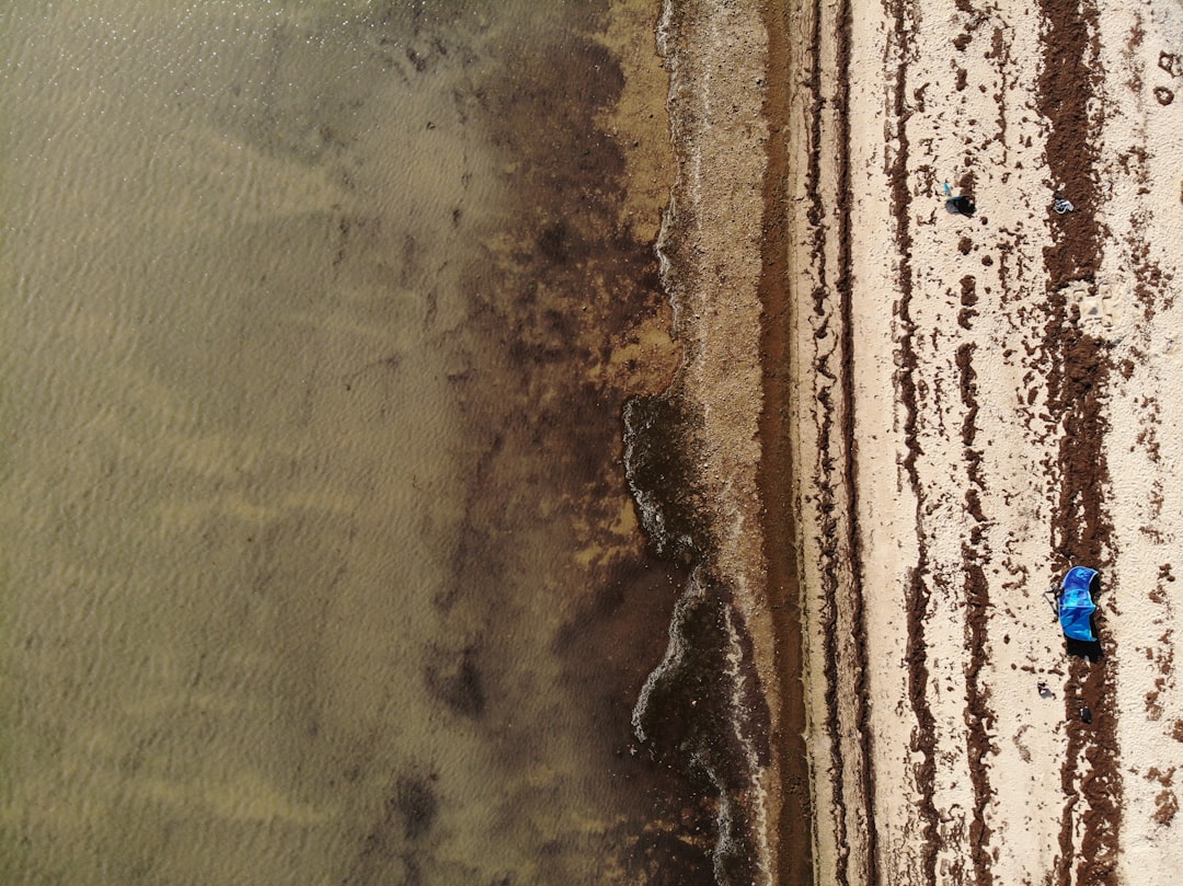 brown and black sand during daytime