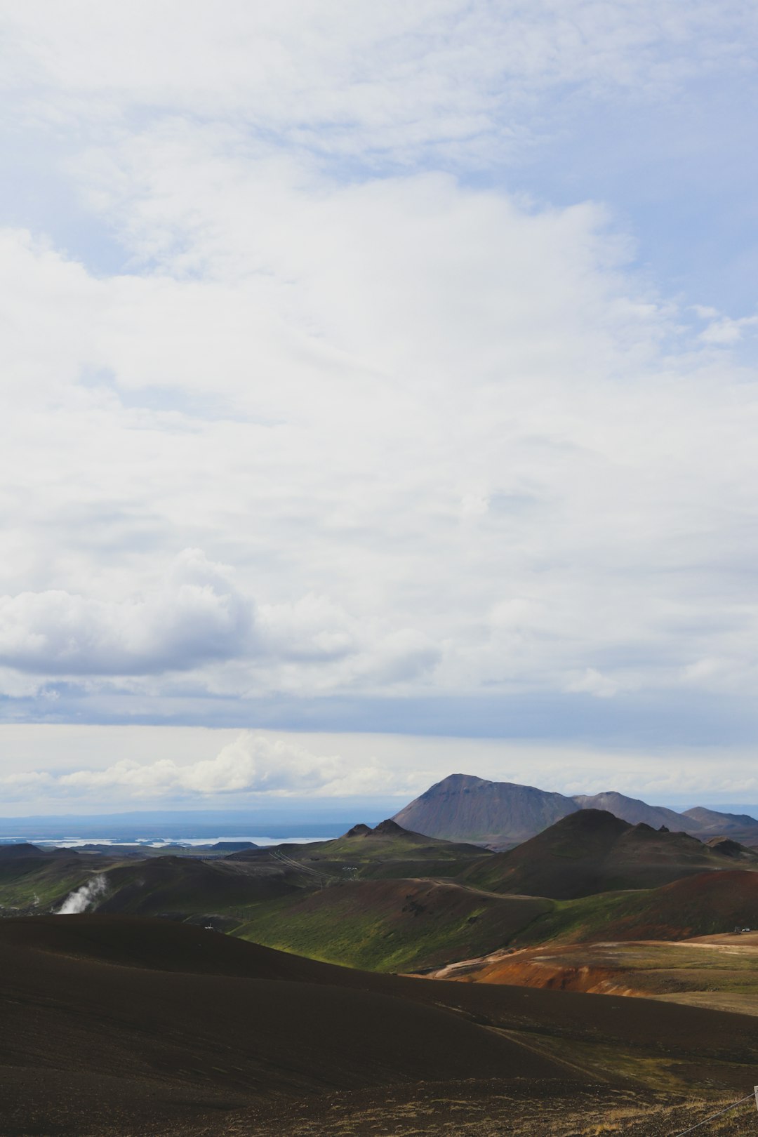 green mountains under white clouds during daytime