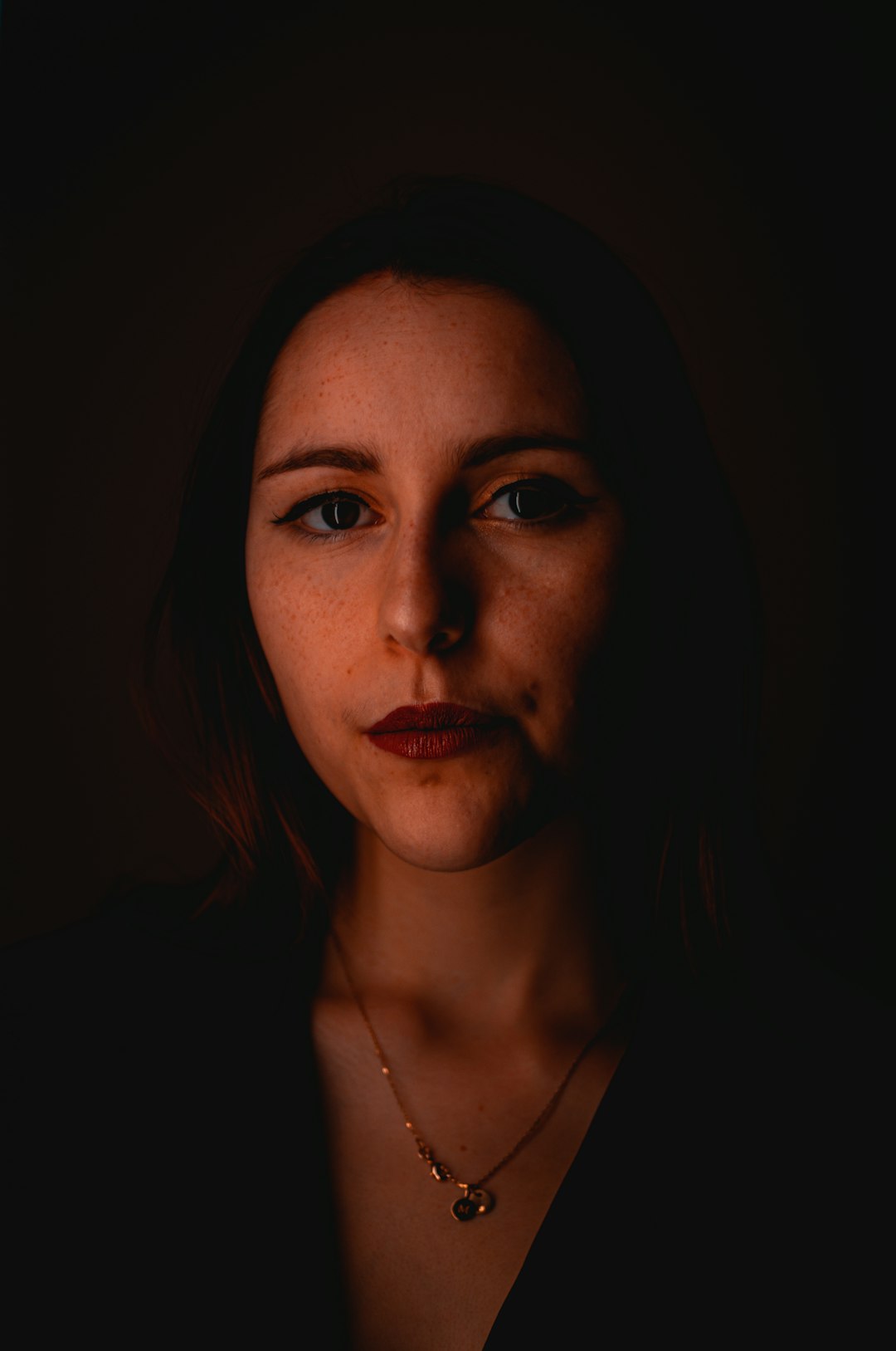 woman in black shirt with red lipstick