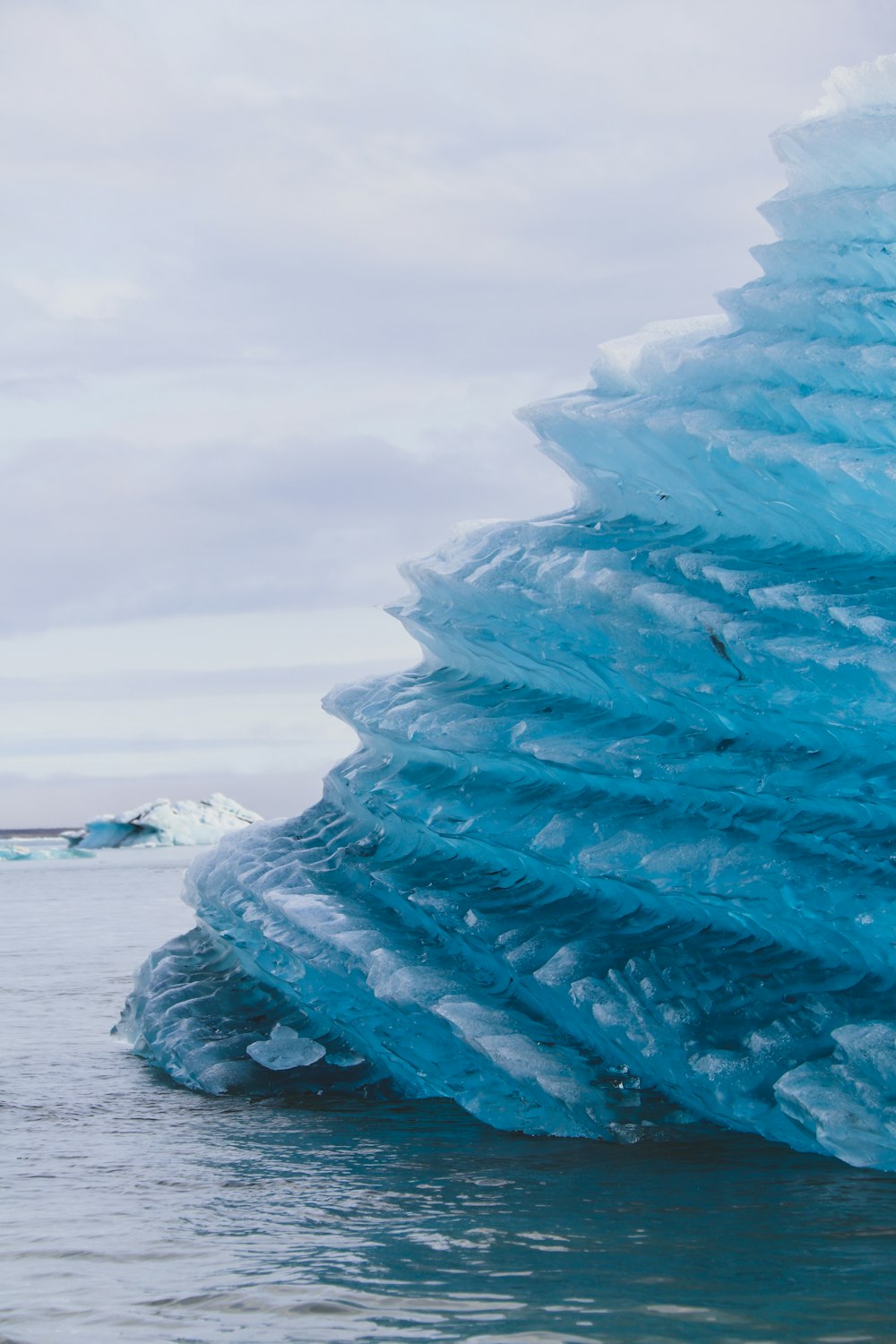 ice formation on white sand during daytime