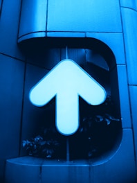 white and black arrow sign