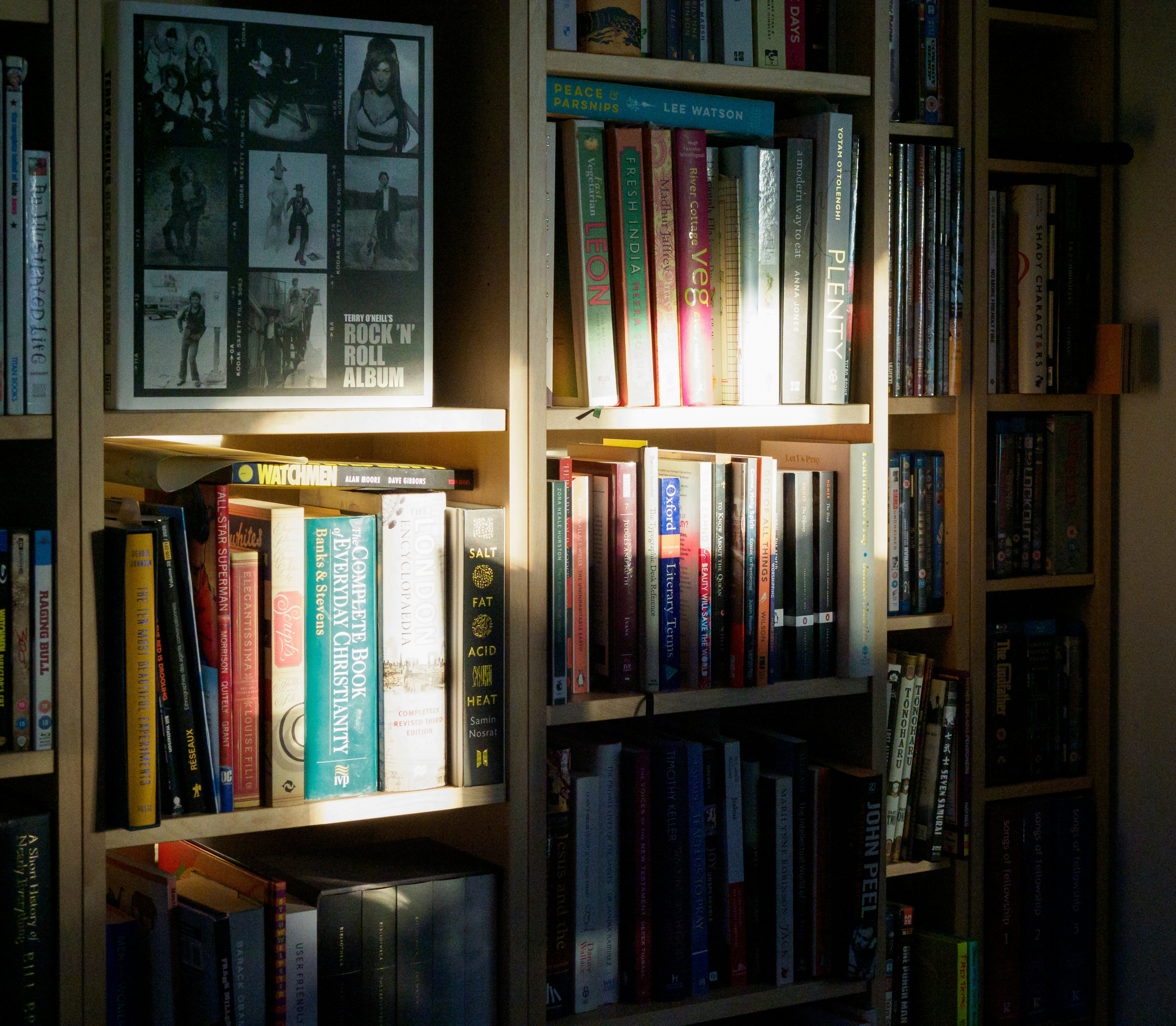books on brown wooden shelf