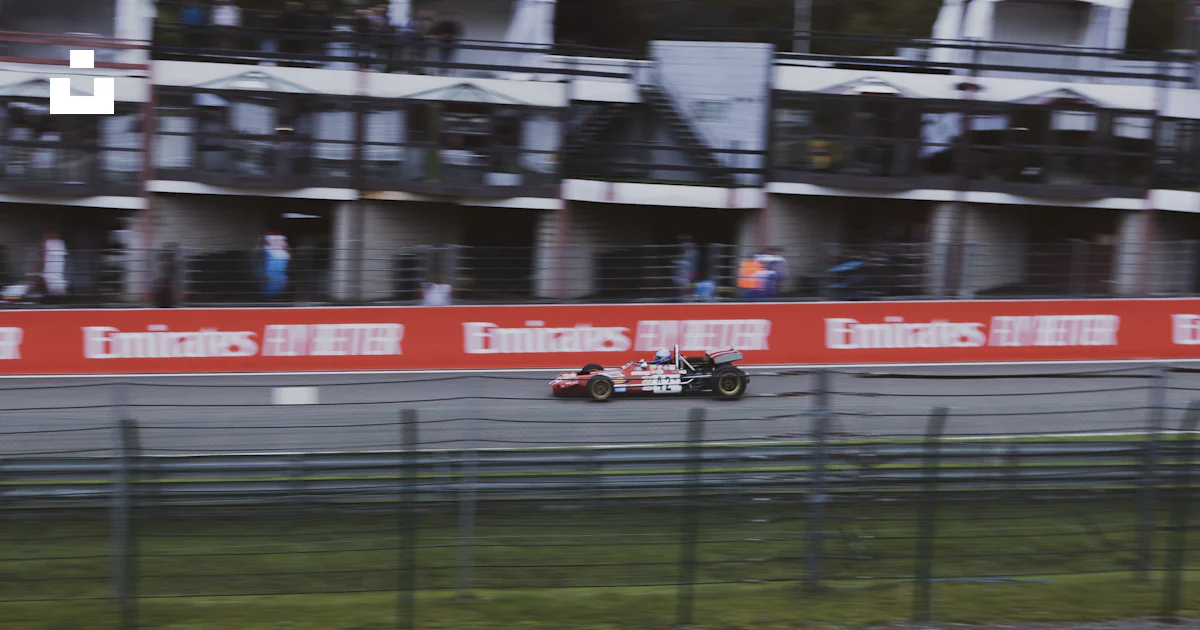 Red and white racing car on track field during daytime photo – Free Car ...