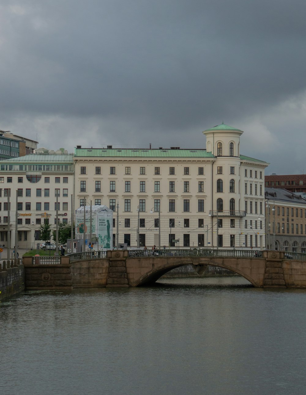 white concrete building near bridge