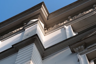 A close-up of detailed painting work on a facade.