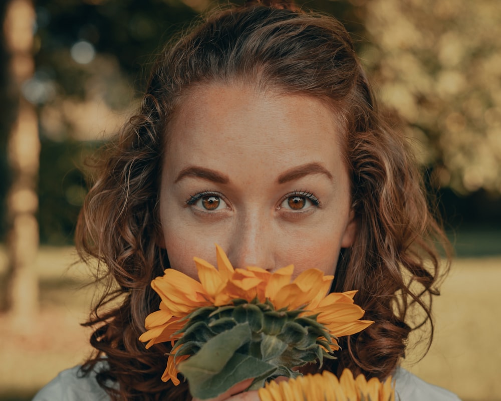 woman with yellow sunflower on her head