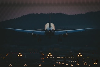 white airplane in the sky during night time
