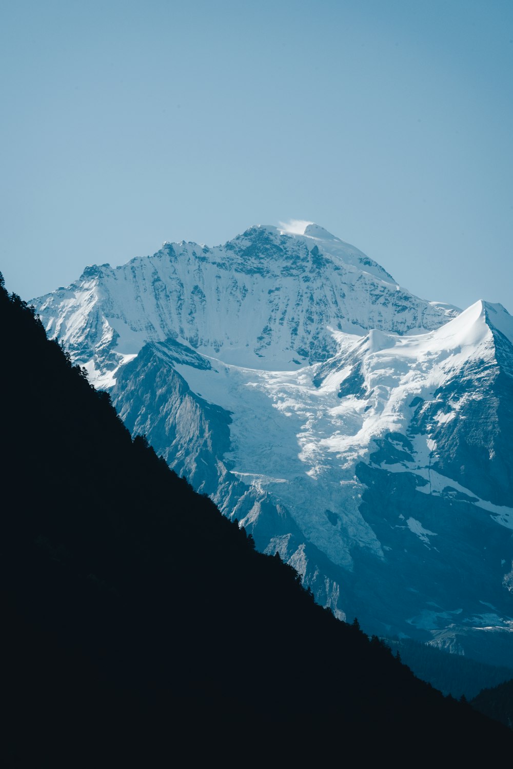 snow covered mountain during daytime