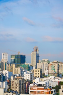 city skyline under blue sky during daytime