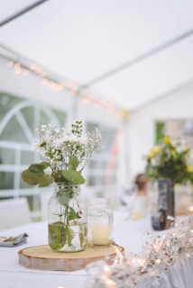 white flowers in clear glass vase