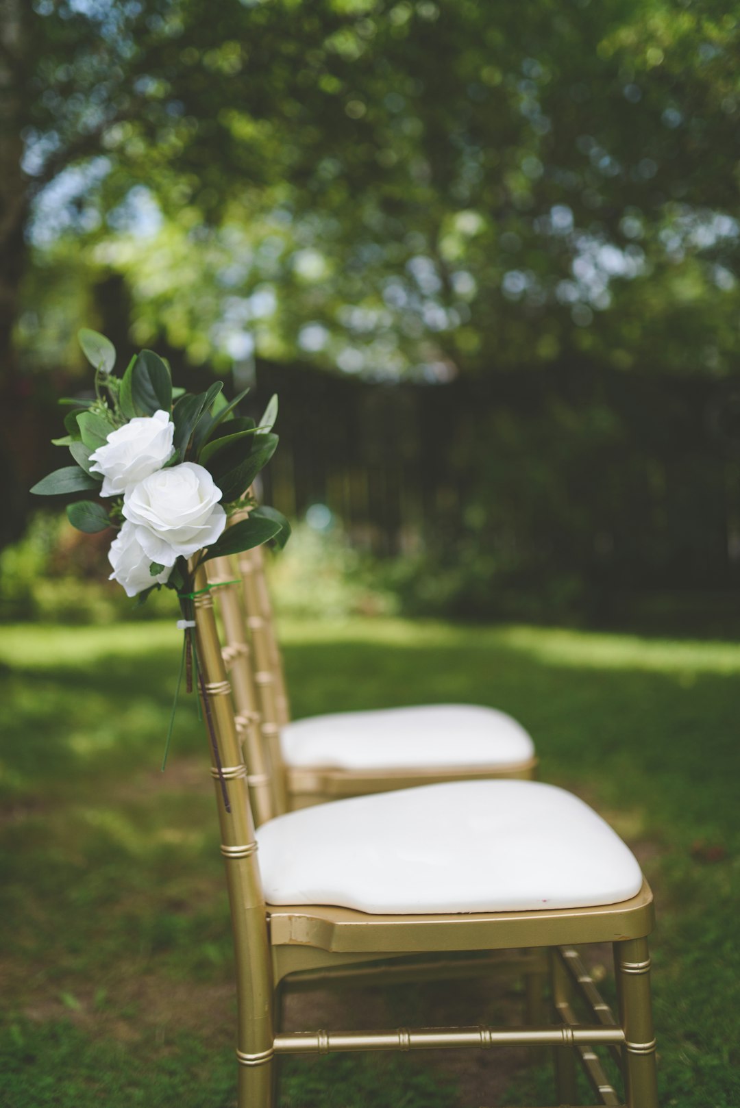 white flower on white padded chair