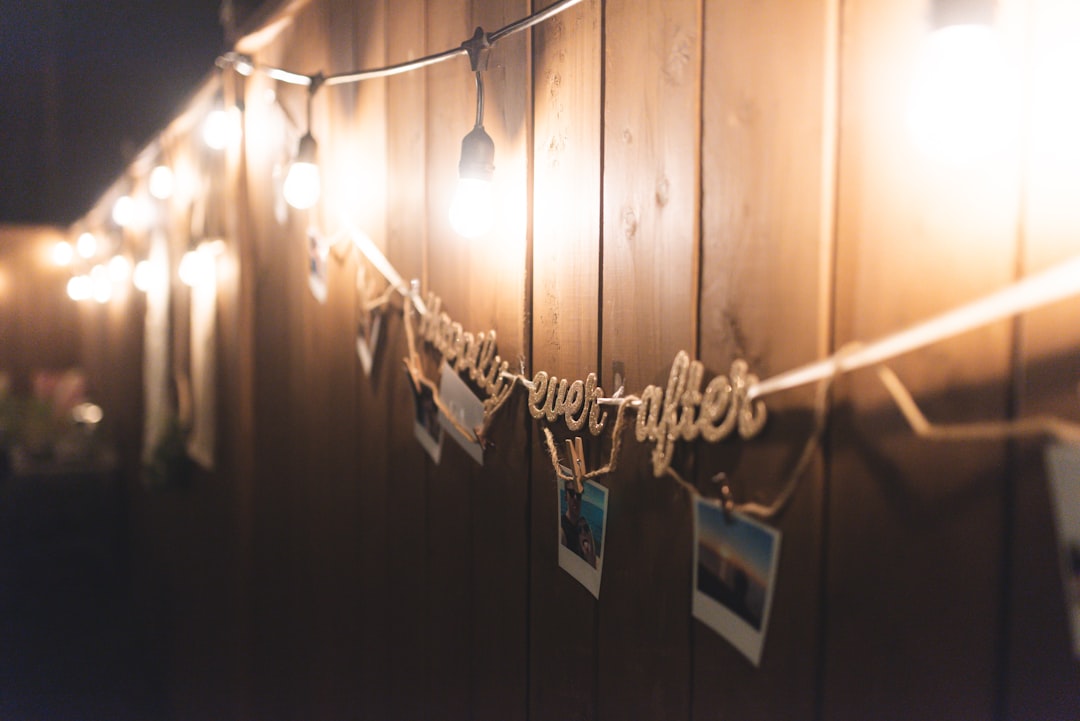 string lights hanged on brown wooden wall