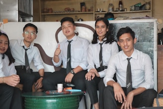 group of people sitting on white chair