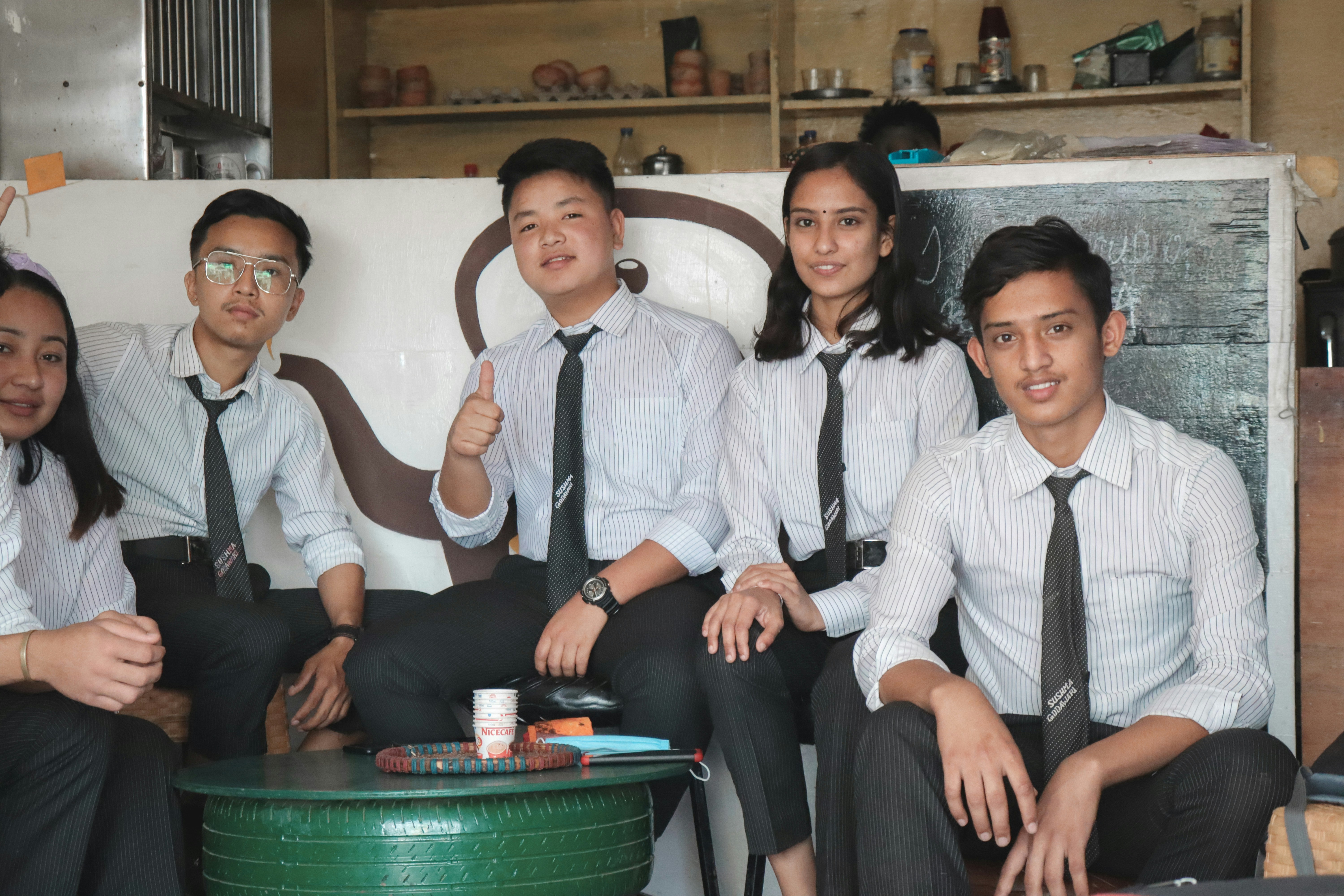 group of people sitting on white chair