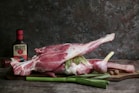 a piece of meat sitting on top of a cutting board