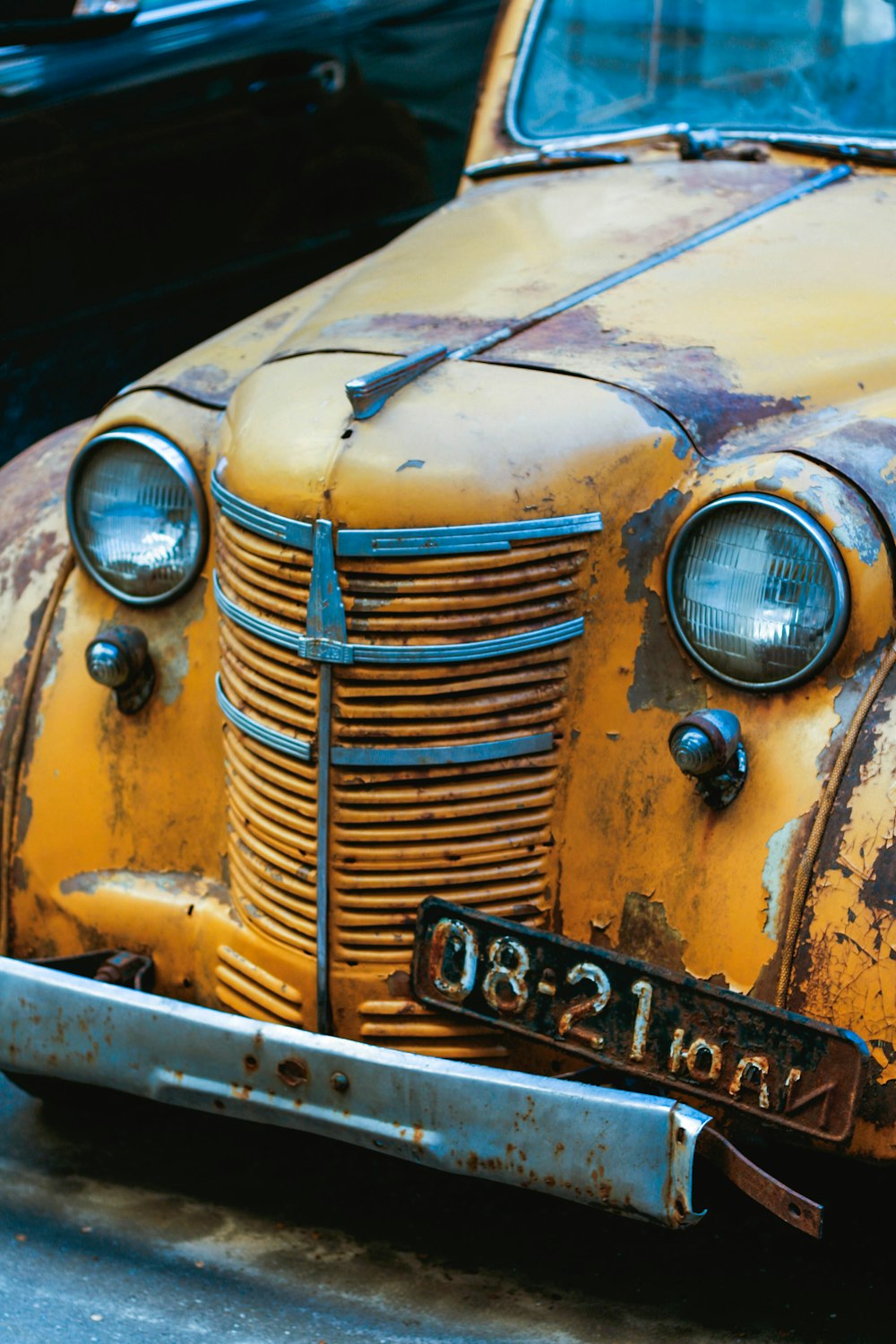 yellow car with white and black license plate