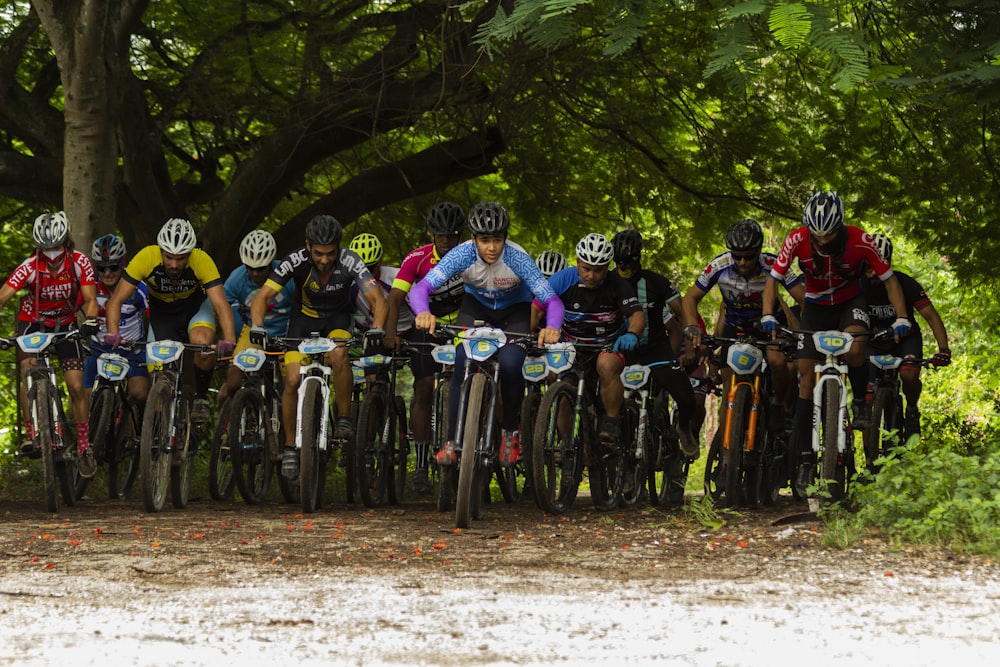 group of people riding bicycles