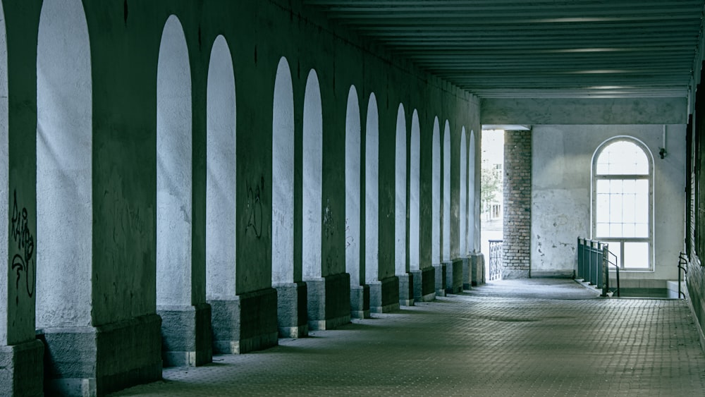 gray concrete hallway with white columns