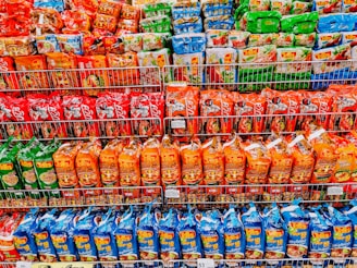 A variety of ready-to-eat meal packages on a shelf.