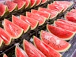 sliced watermelon on stainless steel tray