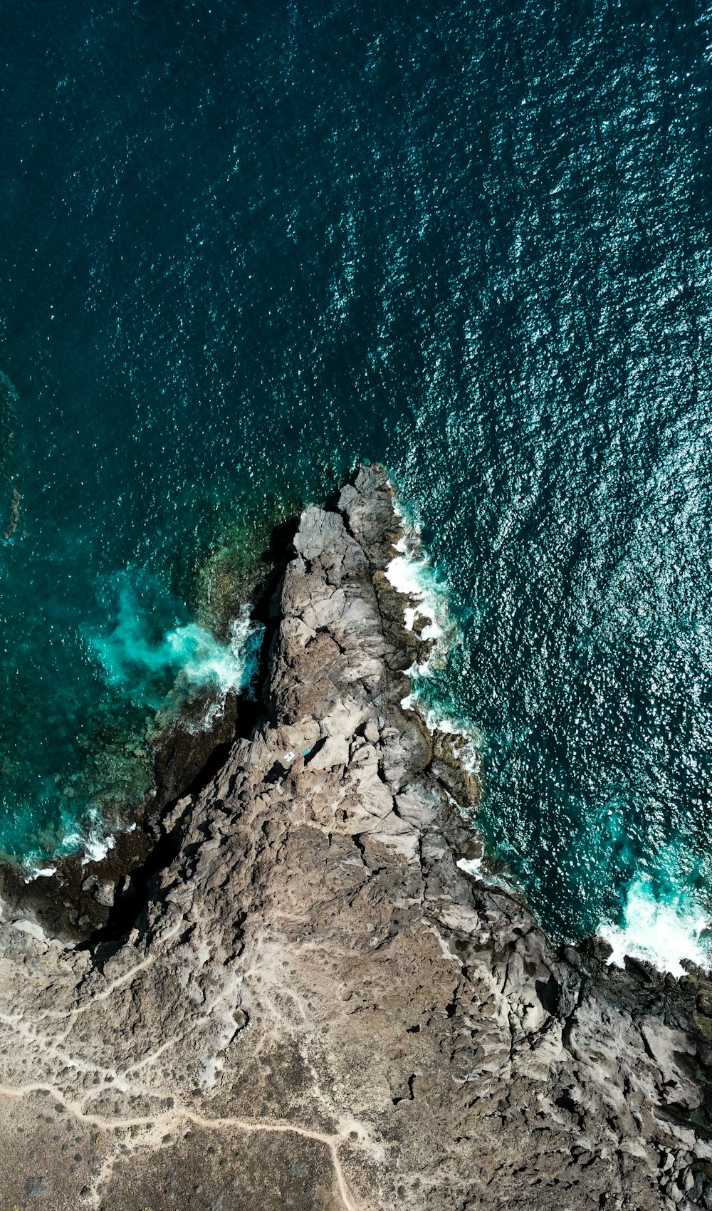 aerial view of rocky shore during daytime