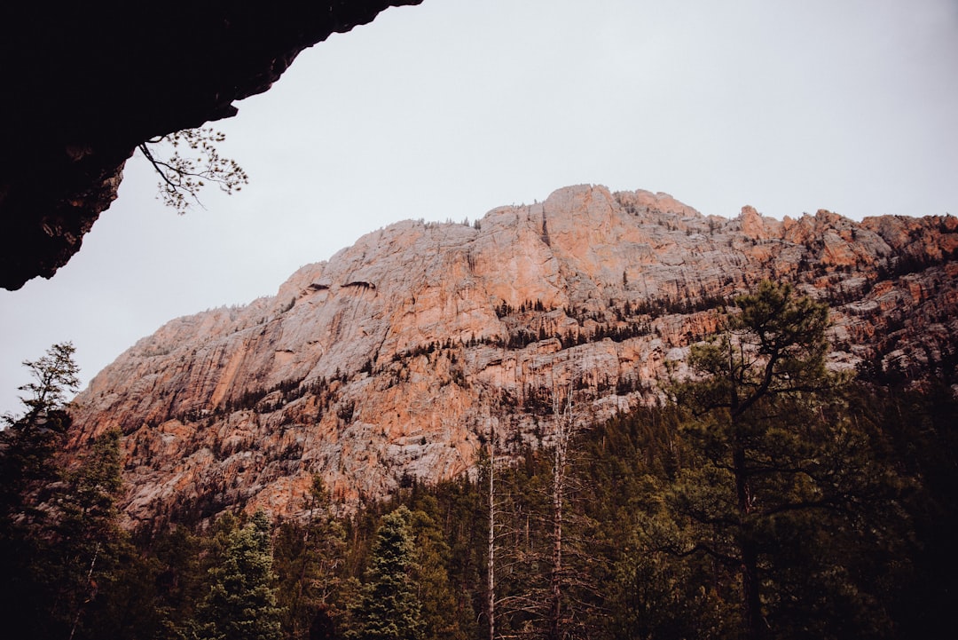 brown rocky mountain under white sky during daytime