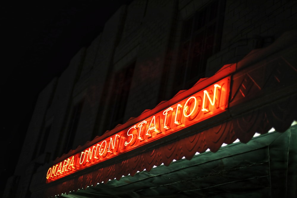 red and white UNKs neon light signage