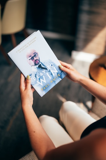 person holding white printer paper