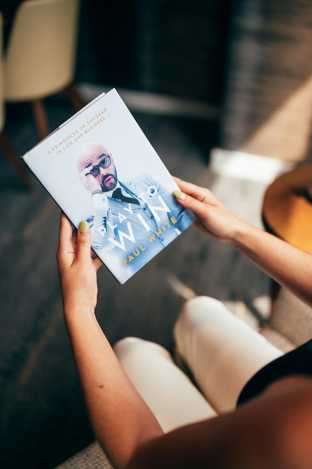 person holding white printer paper