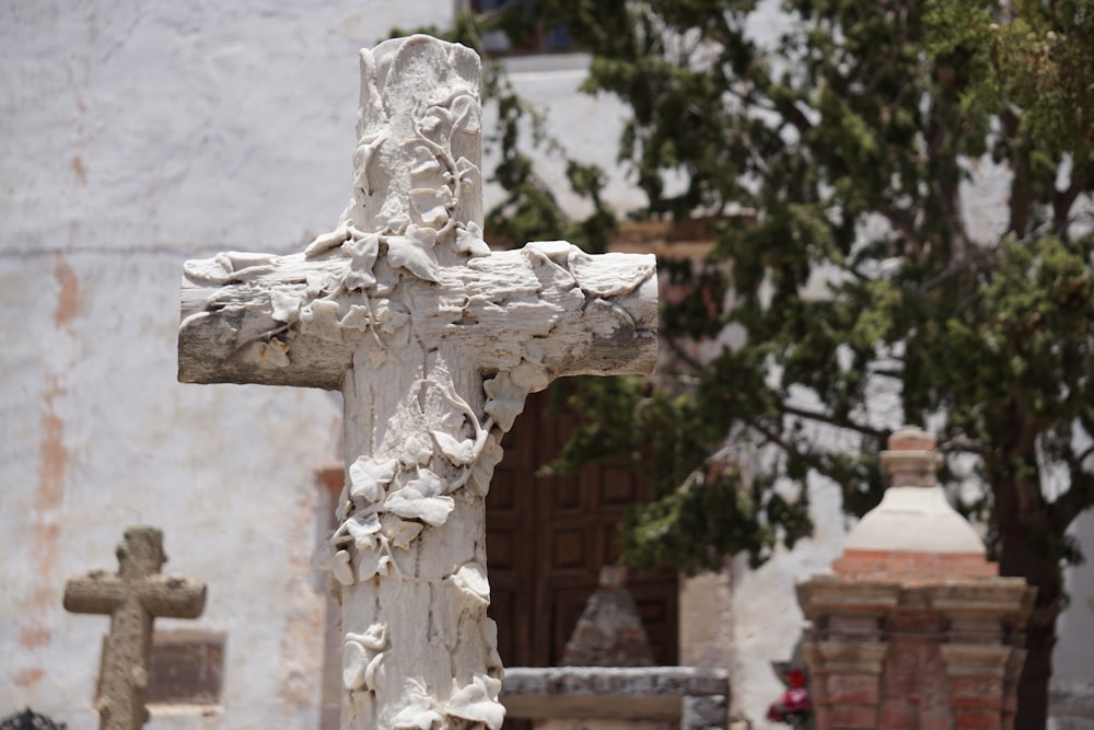 white concrete cross with cross