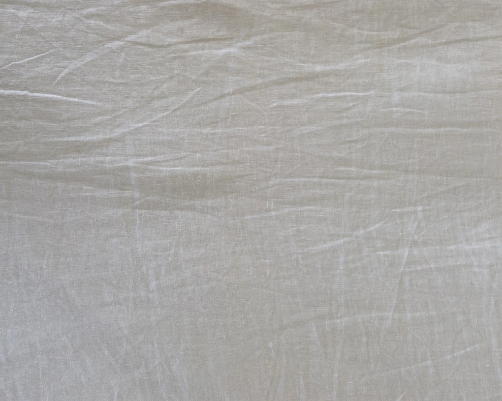 white textile with black hair