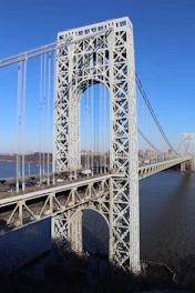 gray bridge over body of water during daytime