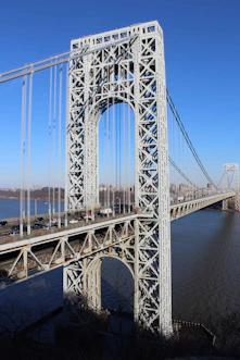 gray bridge over body of water during daytime