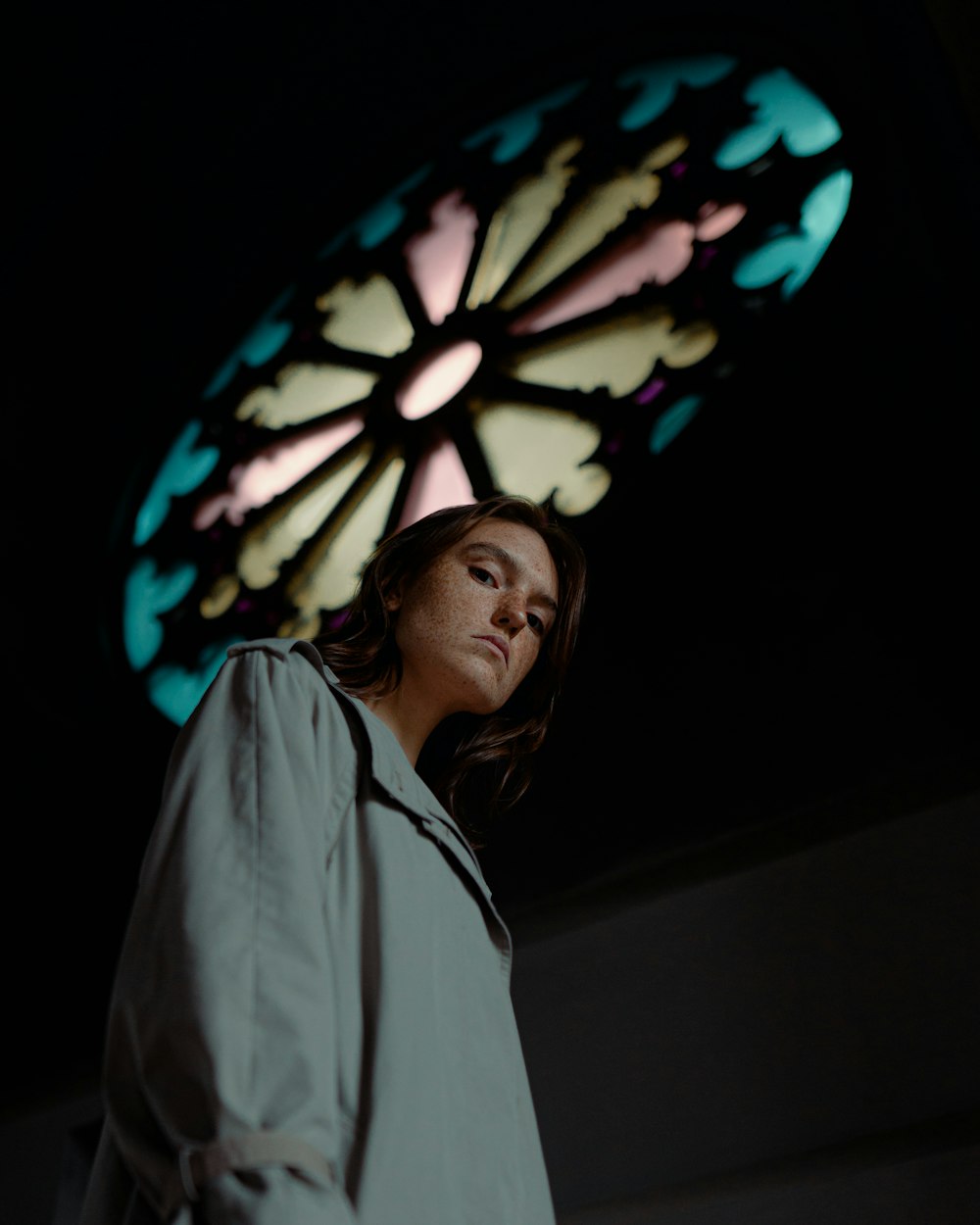 woman in white robe standing near white and black floral lantern