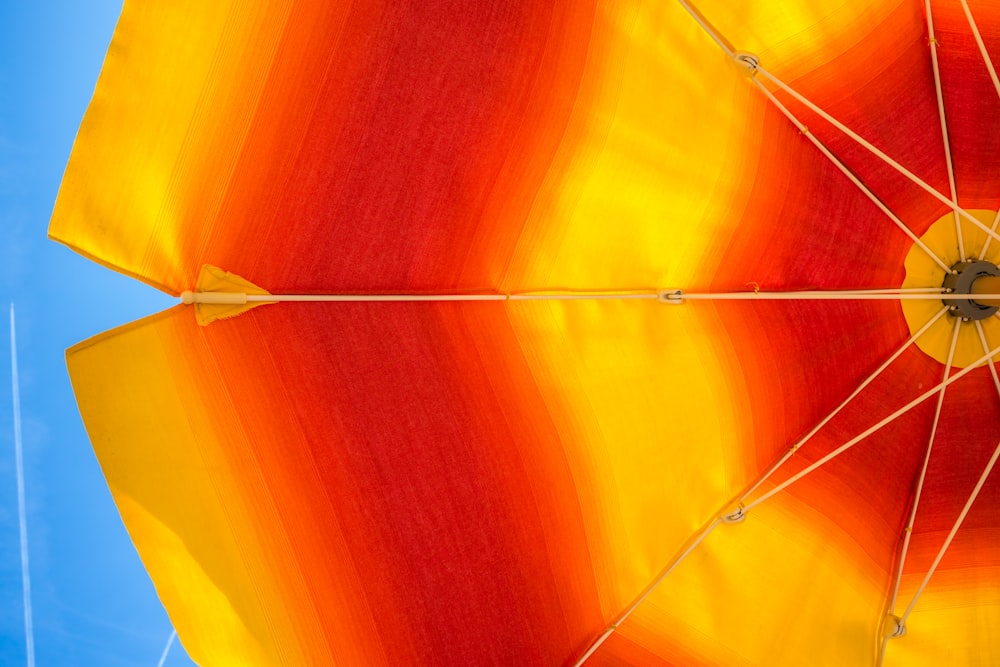 orange umbrella with yellow background