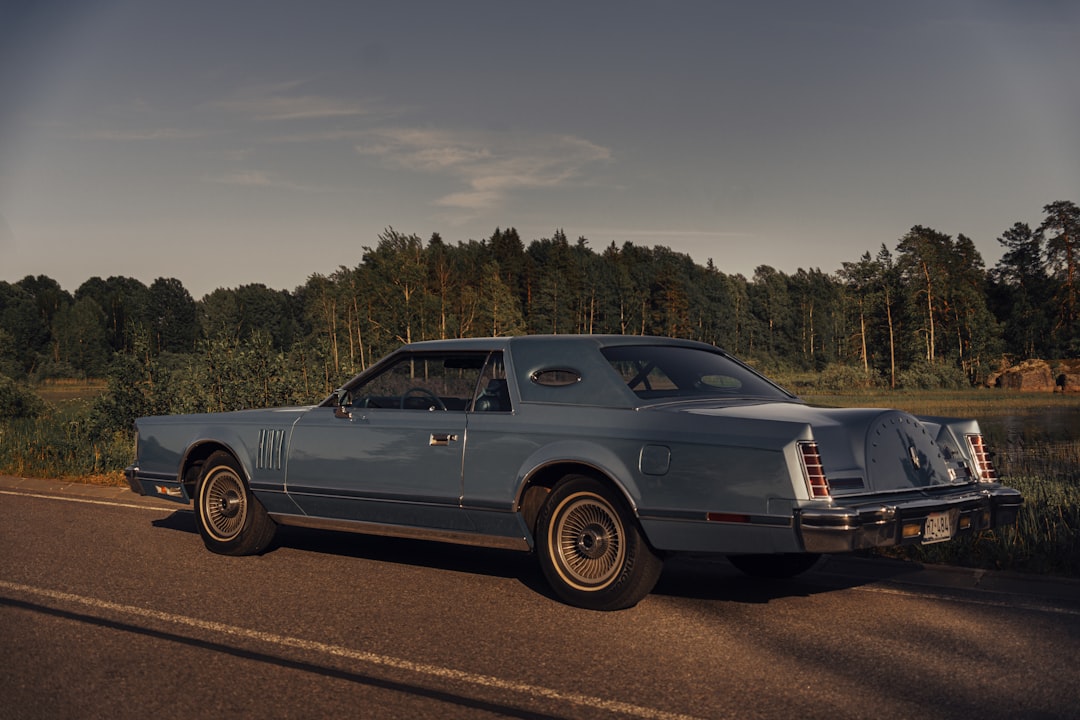 silver coupe on road during daytime