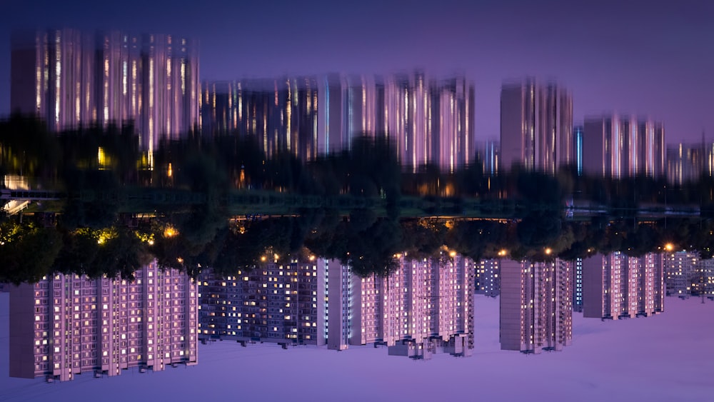 city skyline reflecting on water during night time