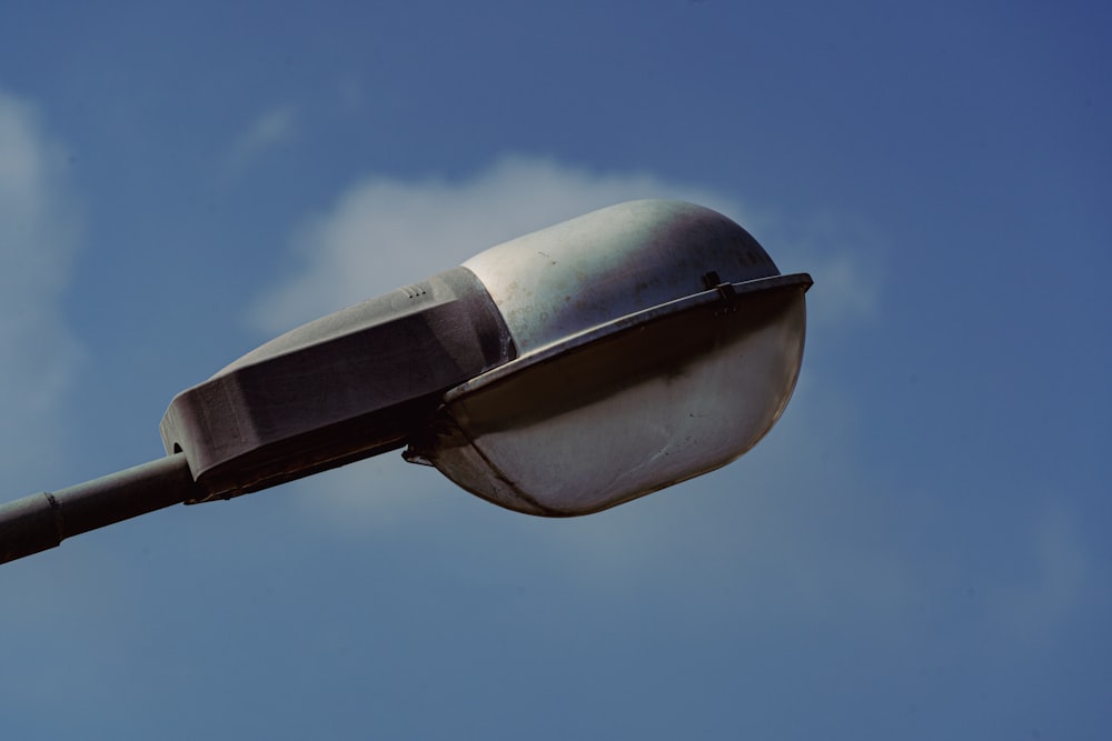 black and white outdoor lamp under blue sky during daytime