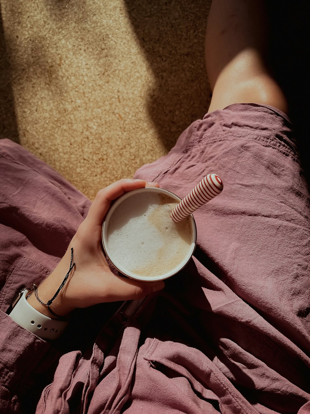 person holding white ceramic mug