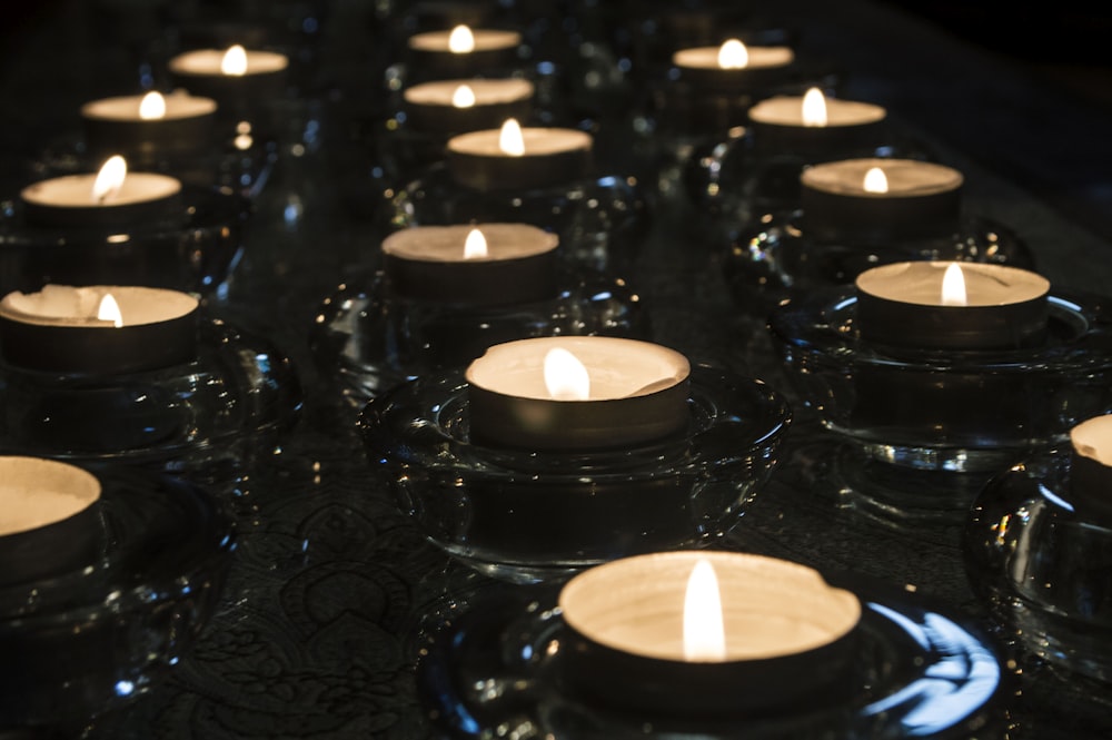 lighted candles on black surface