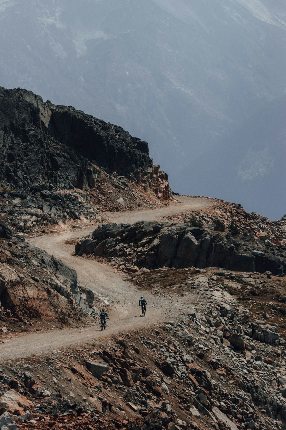people walking on brown rocky mountain during daytime