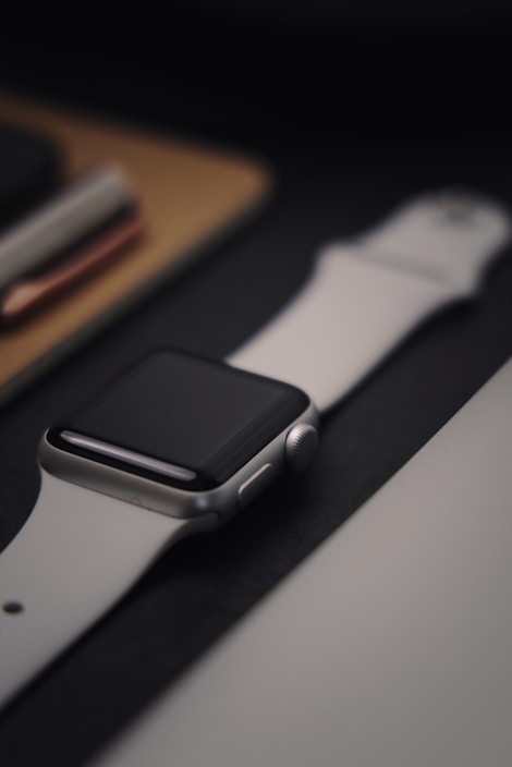 A sleek smartwatch on a city bench reflecting urban life.