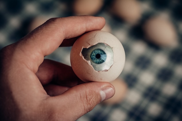 A glowing egg cracking open to reveal vibrant digital code and AI symbols inside.