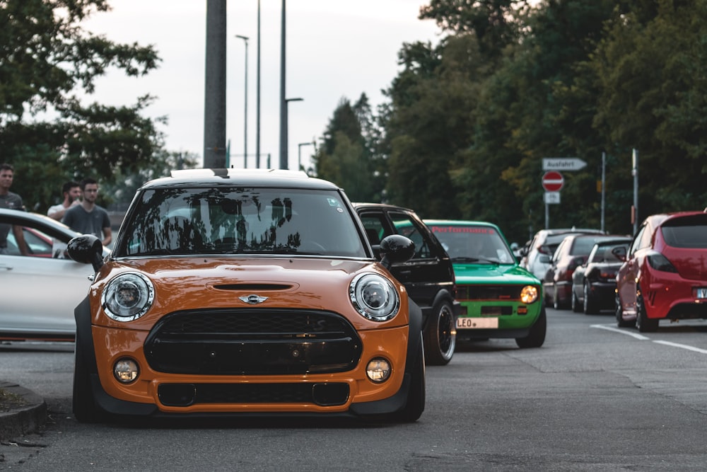 orange chevrolet car on road during daytime