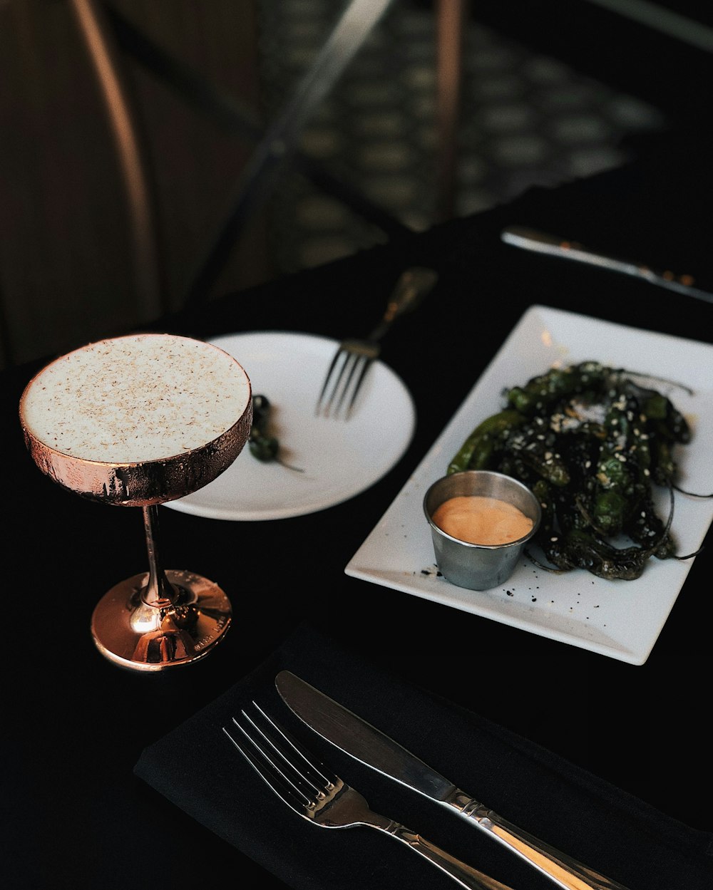 stainless steel fork on white ceramic plate